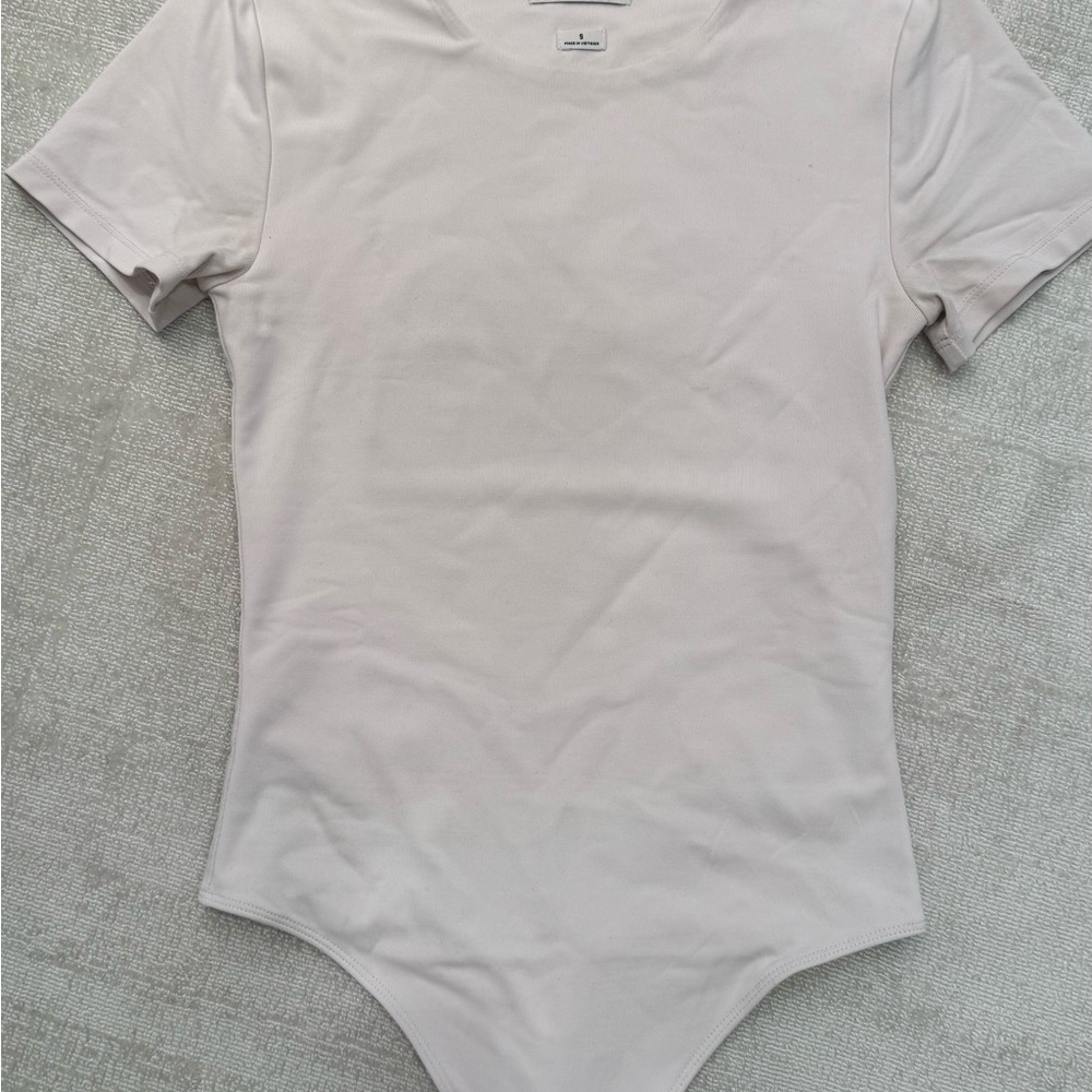Babaton Short Sleeve One-Piece Bodysuit in eggshell off white color